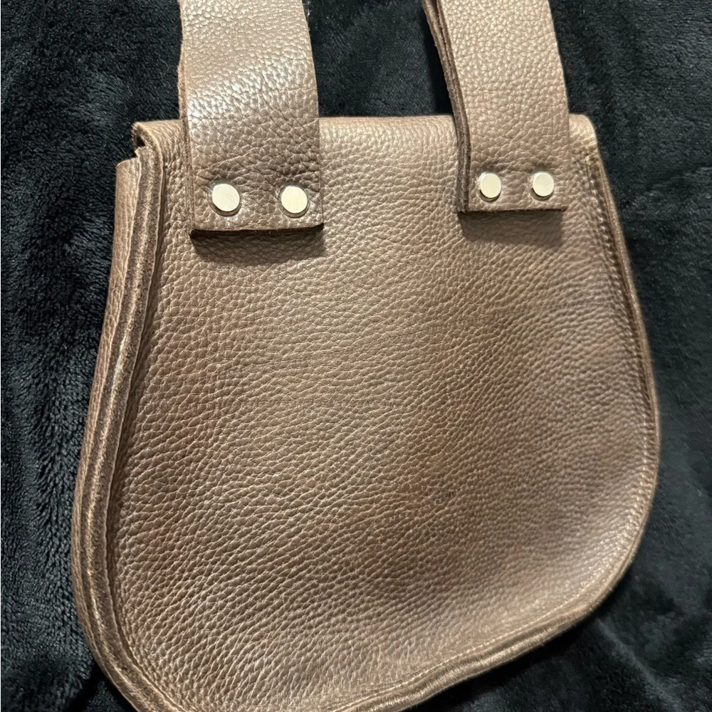 Brown Leather Backpack with Classic Design and Flap Closure